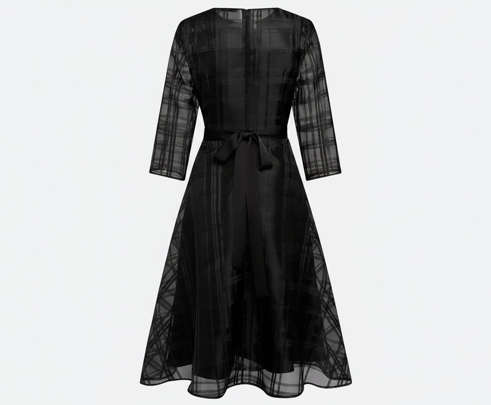 Black dress with sheer sleeves on a white background