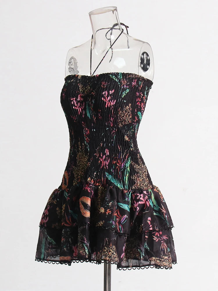 Black strapless dress with colorful floral pattern on a mannequin against a white background