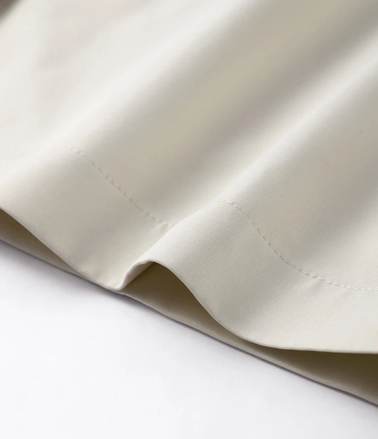 Close-up of beige fabric on a white background