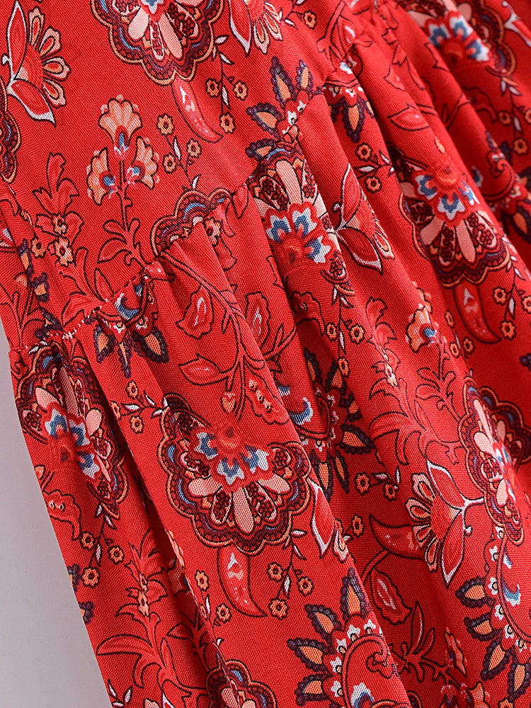 Close-up of red fabric with intricate floral and paisley pattern