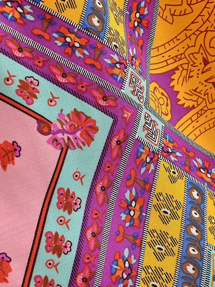 Colorful fabric with intricate patterns and designs.