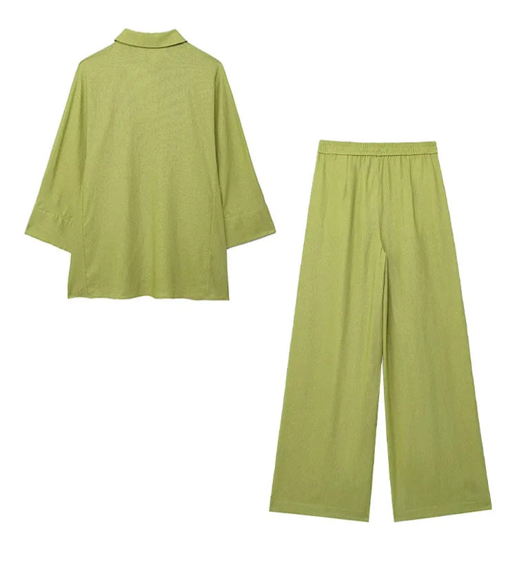 Green outfit with shirt and pants on a white background