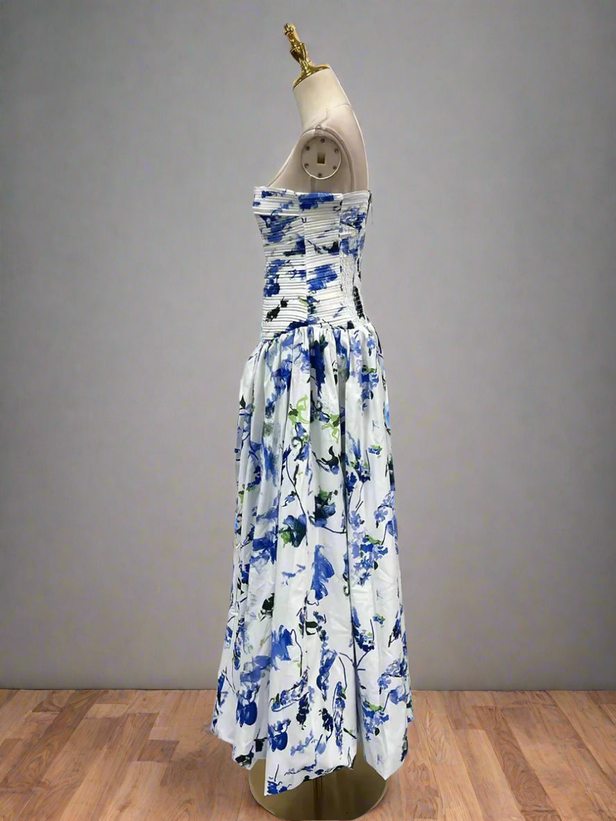 Floral strapless dress on a mannequin against a plain background
