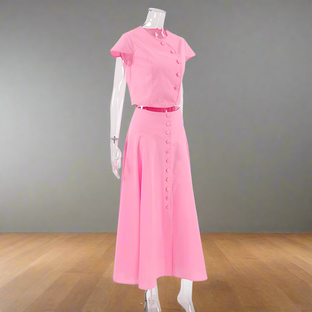 Pink dress on a mannequin against a white background