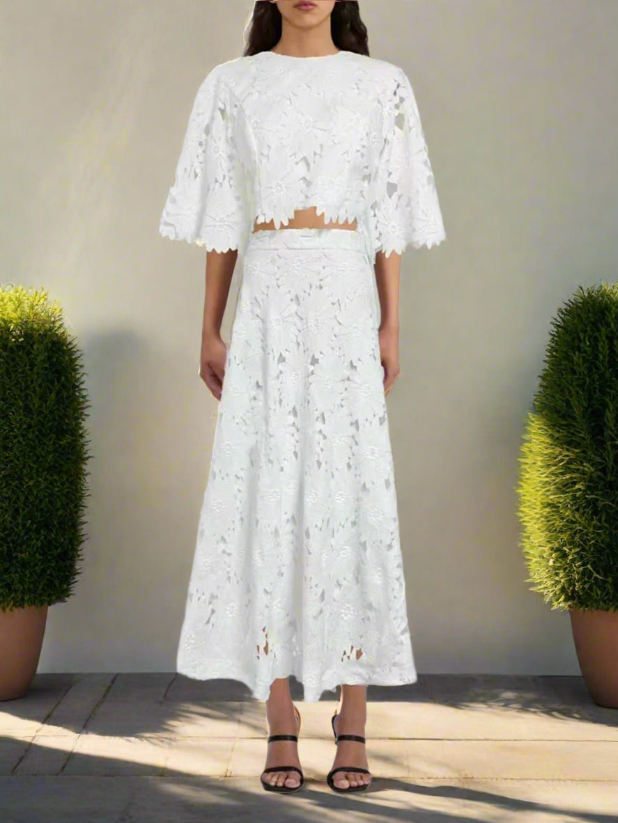 White lace outfit on a plain background