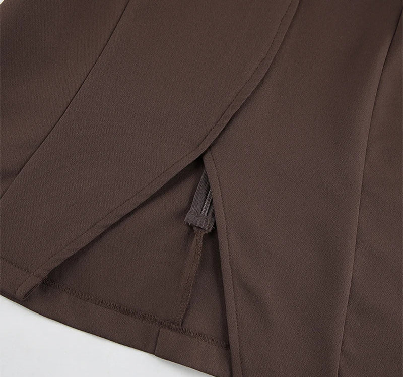 Close-up of a brown fabric with a visible seam on a white background