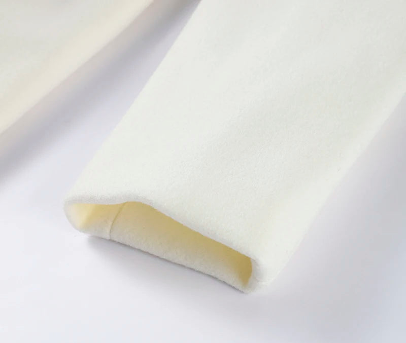 White paper with a folded beige strip on a white background