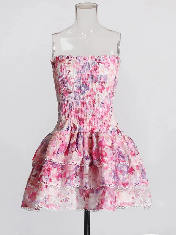 Floral dress on a mannequin against a white background