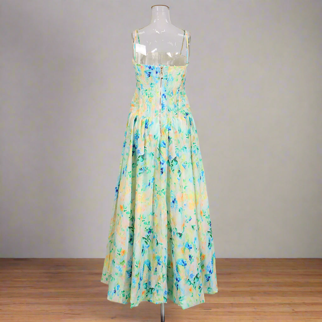 Floral dress on a mannequin against a plain background