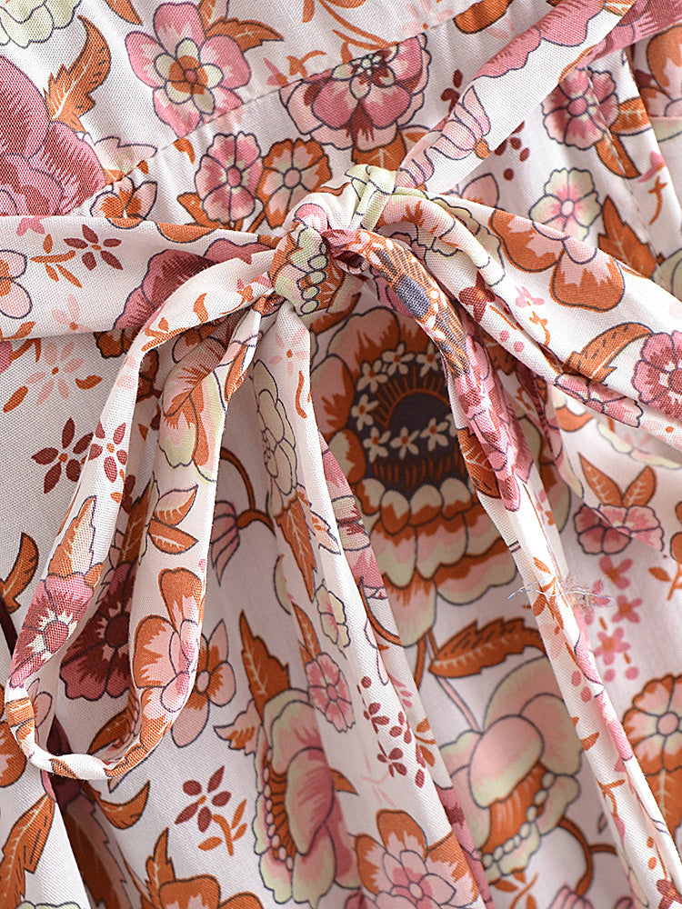 Floral fabric with pink and orange flowers on a white background