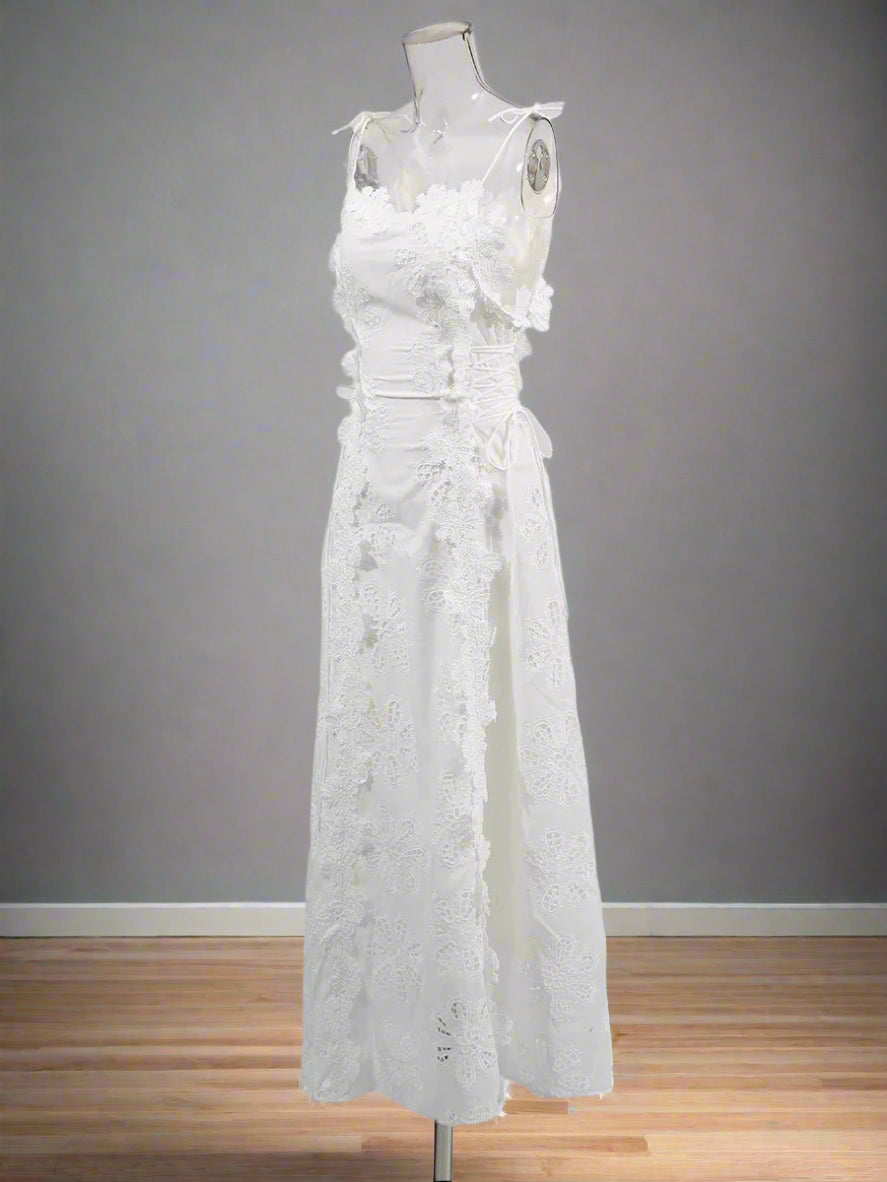 White lace dress on a mannequin against a white background