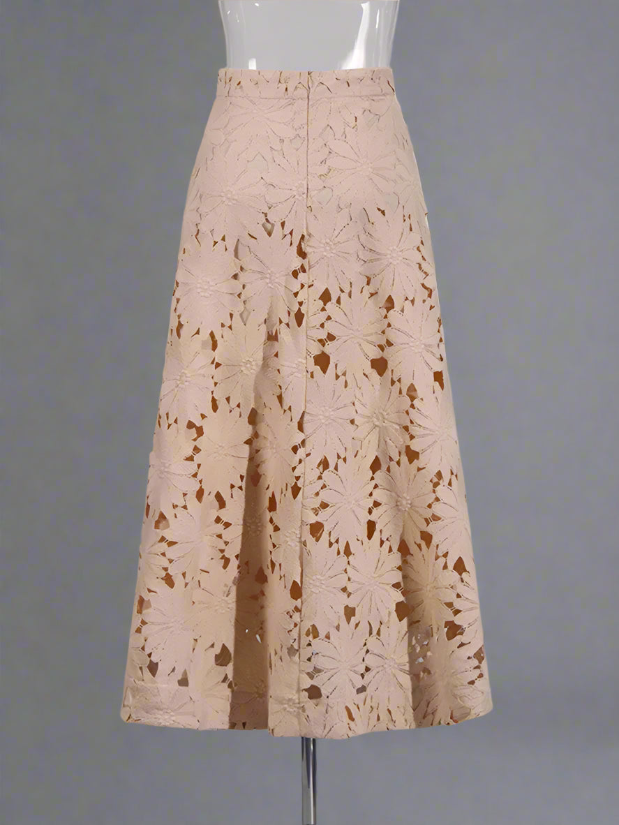 Beige lace skirt on a mannequin against a plain background