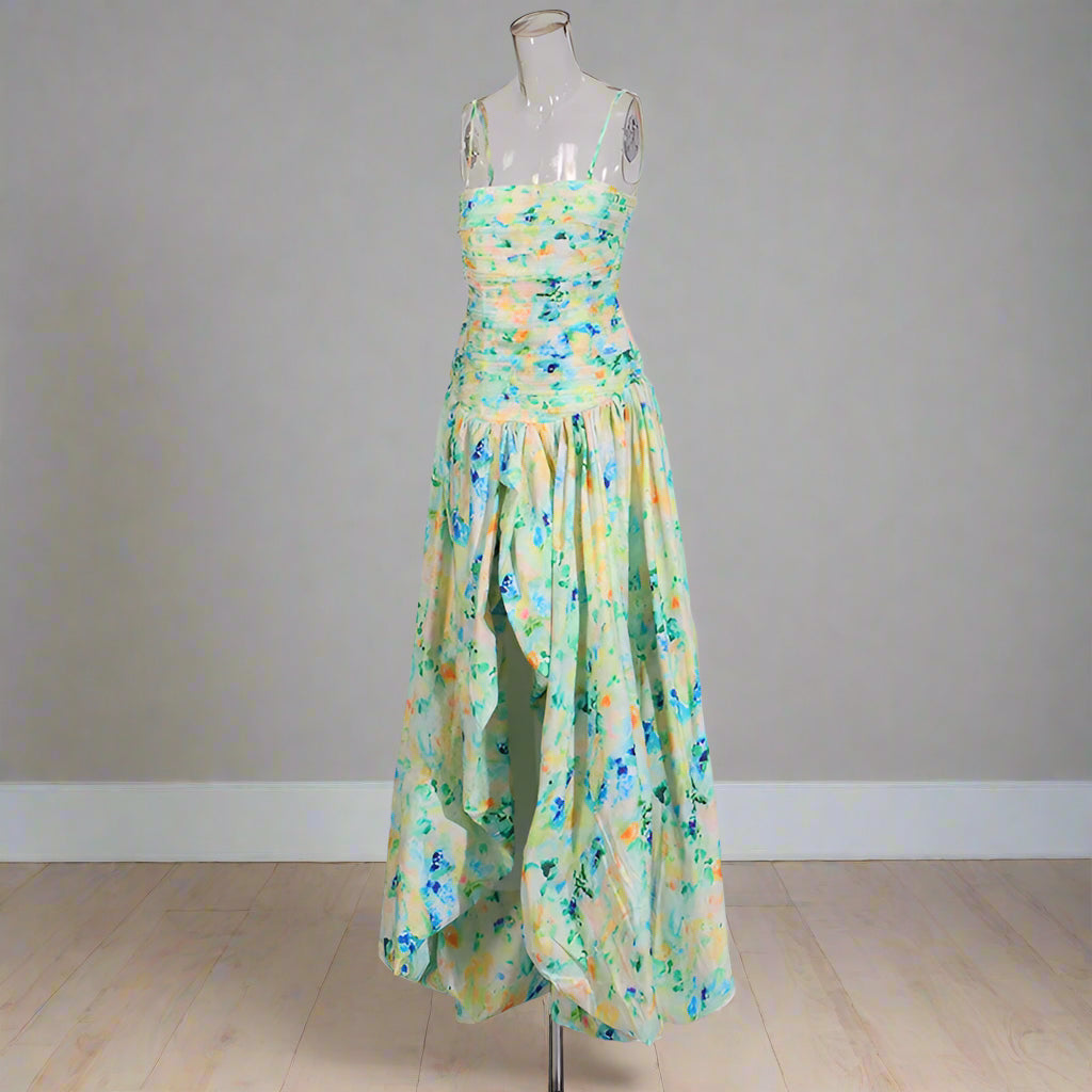 Floral dress on a mannequin against a plain background