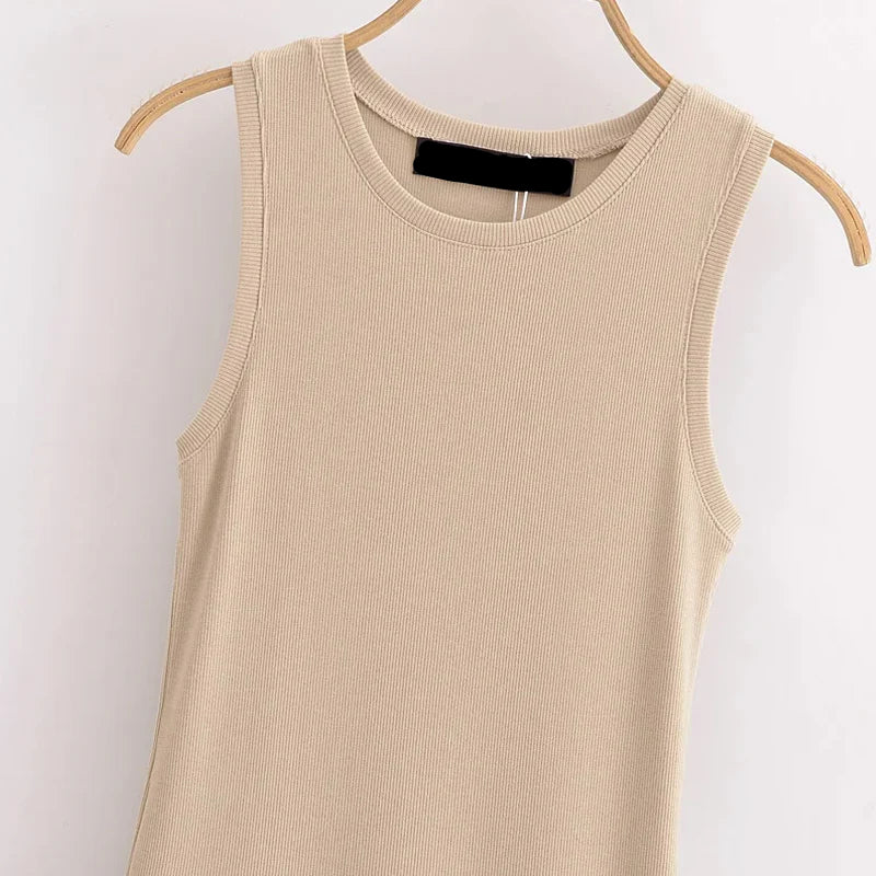 Beige tank top on a hanger against a white background