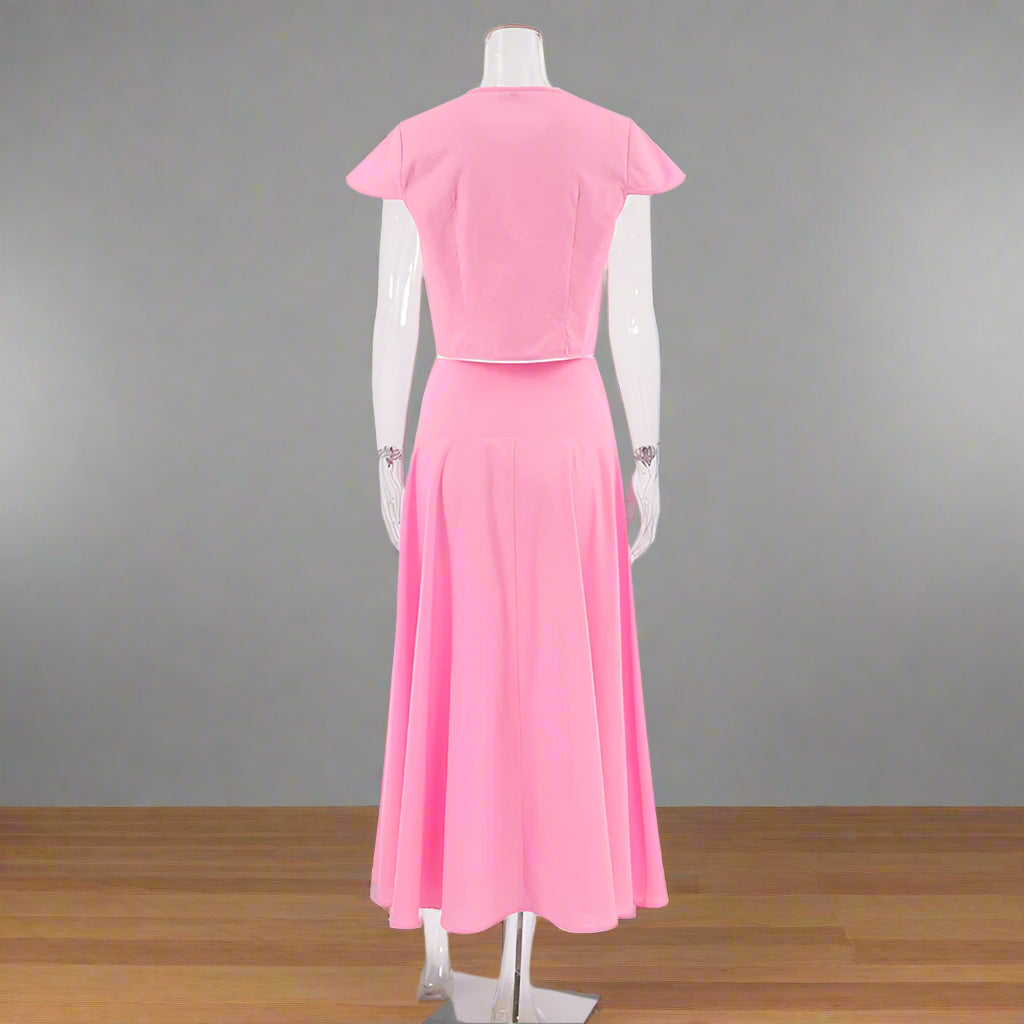 Mannequin wearing a pink dress on a white background