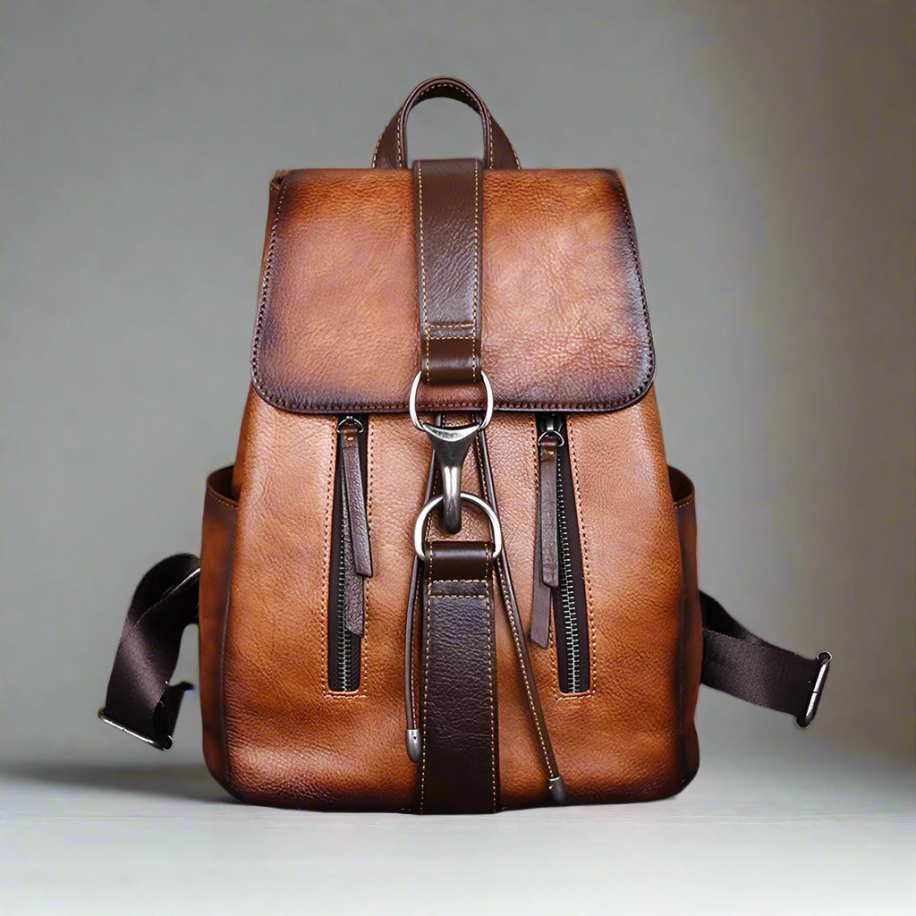 Brown leather backpack on a white background