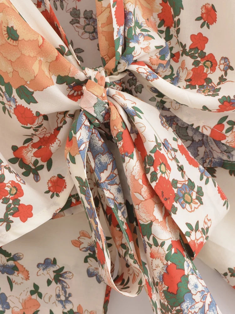 Close-up of a floral-patterned fabric with a bow