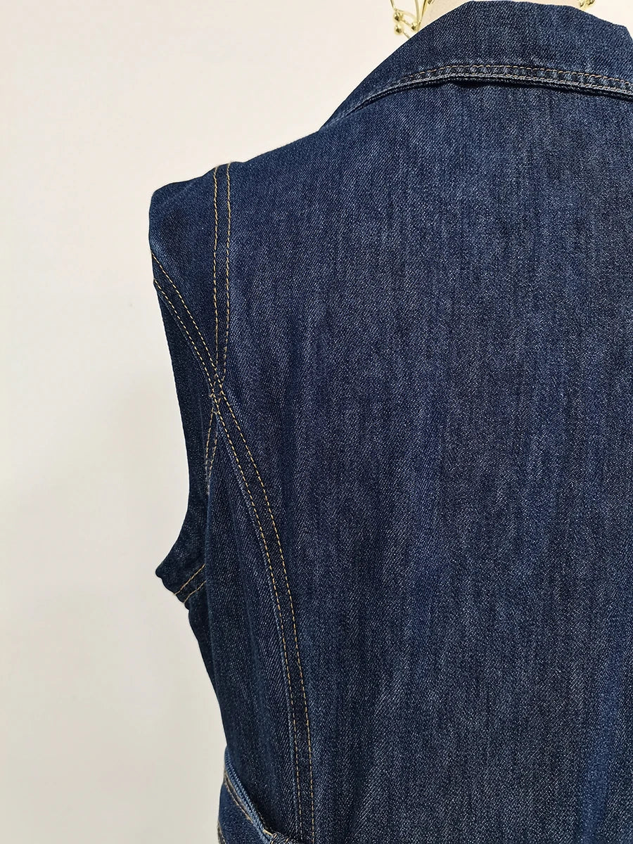 Blue denim vest on a light beige background