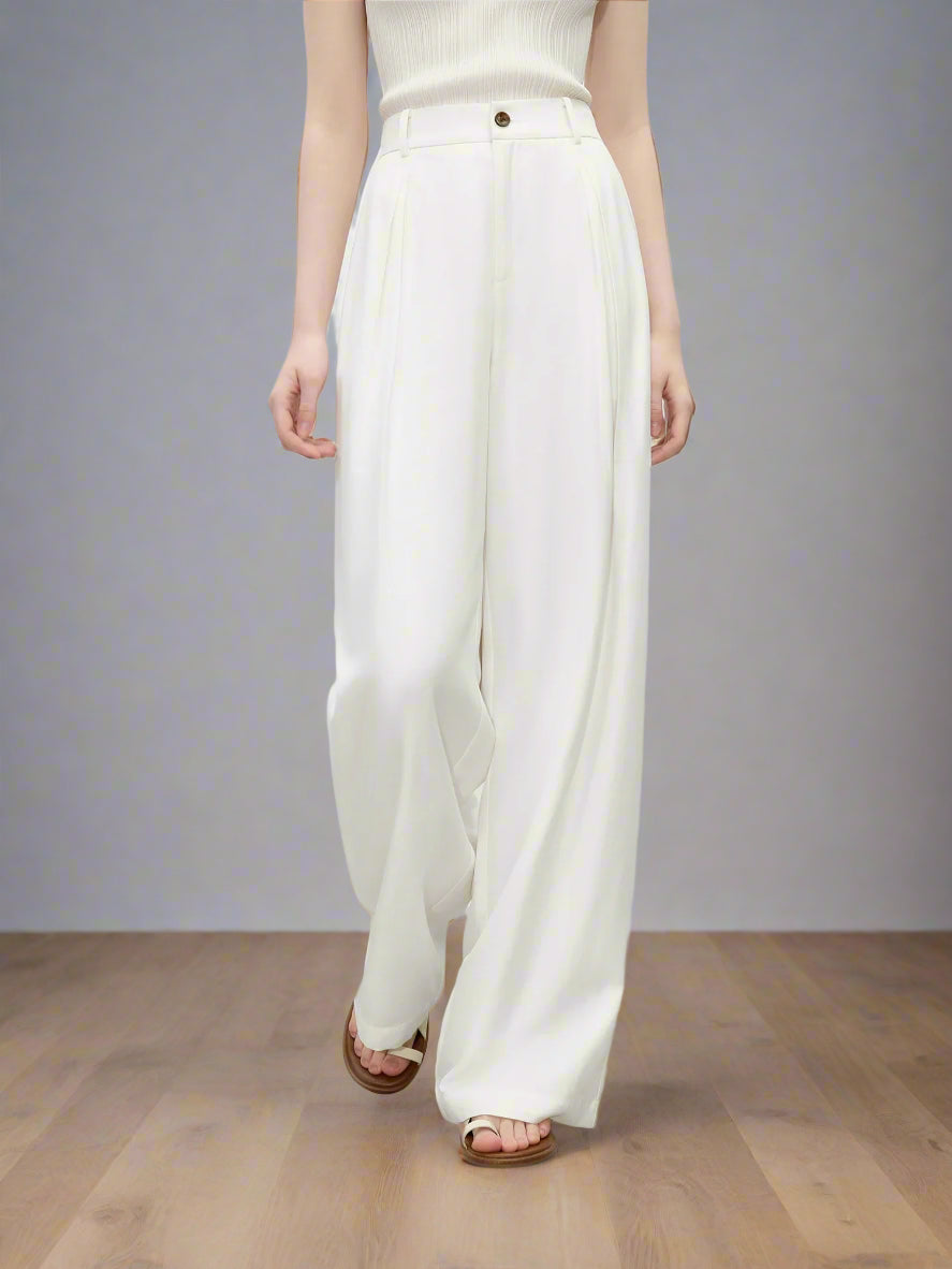 White wide-leg pants worn by a person on a plain background