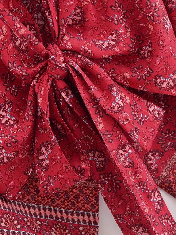 Red patterned fabric with a knot detail