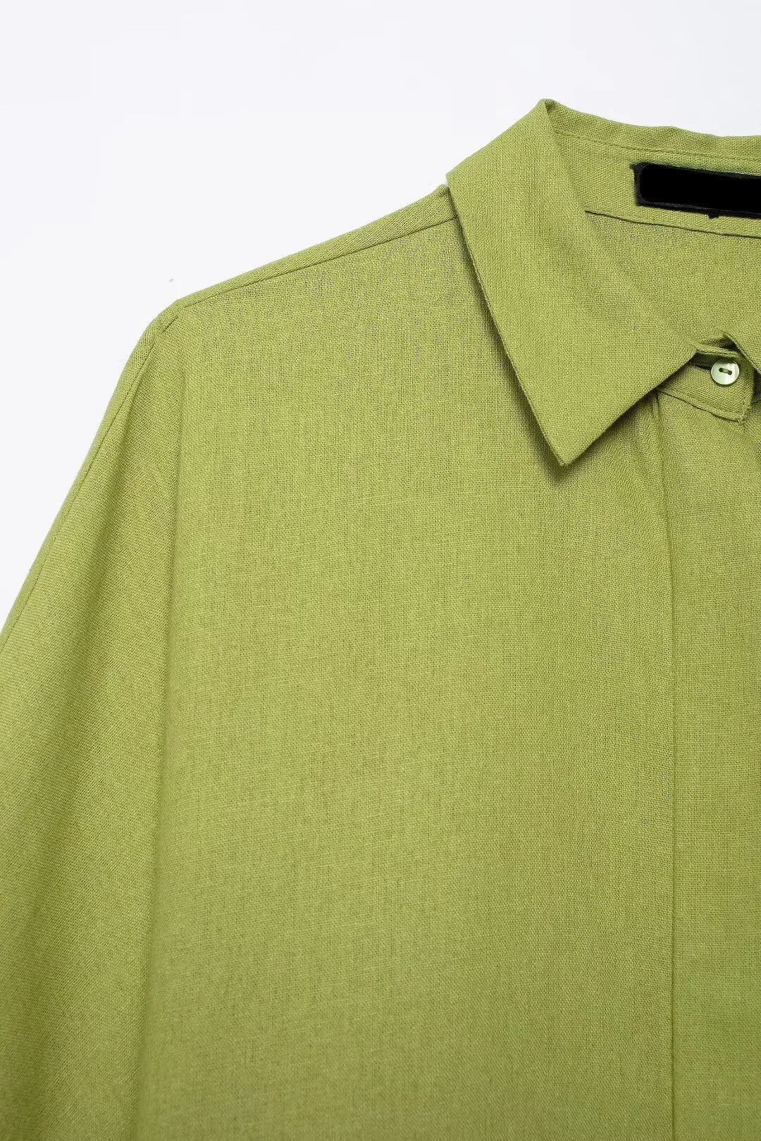Green shirt with collar on a white background