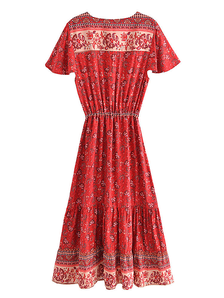 Red patterned dress on a white background