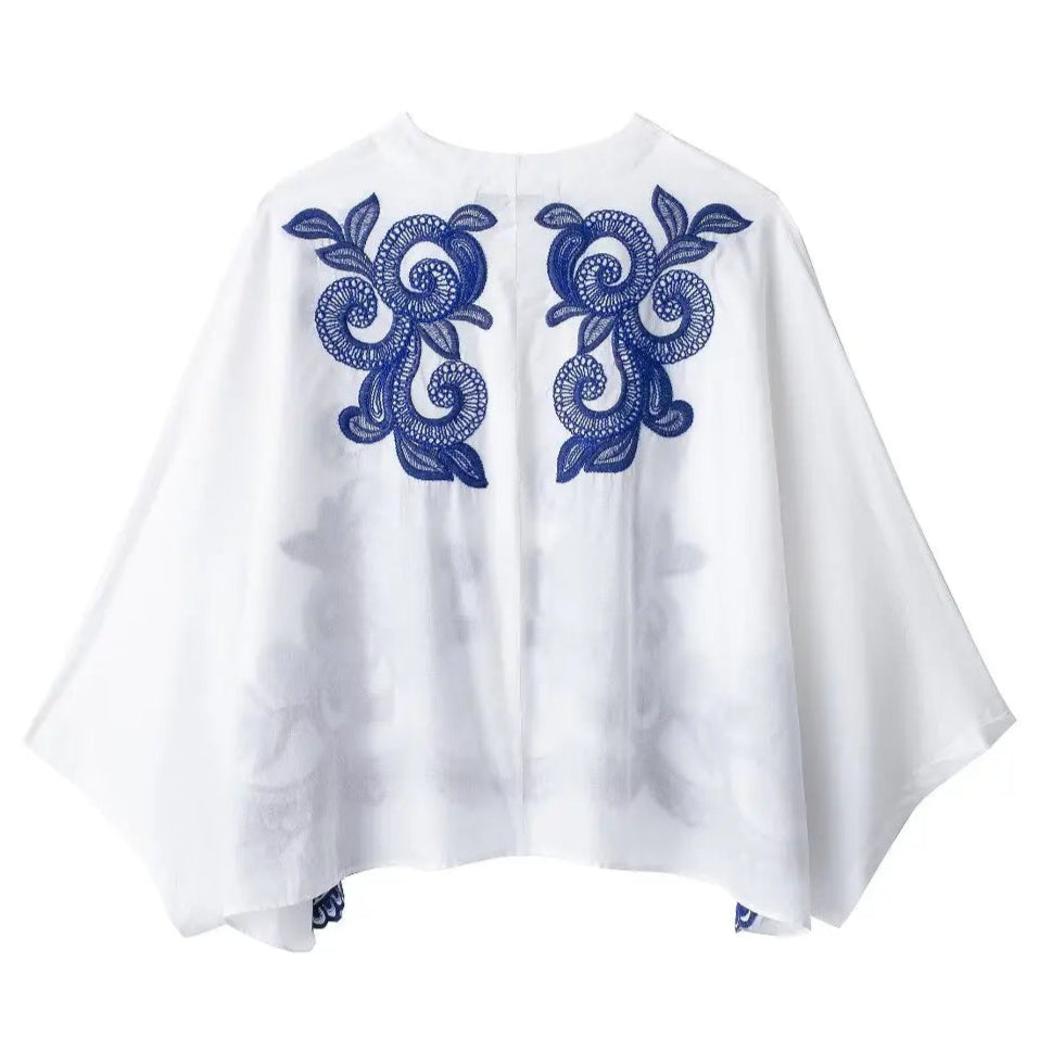 White garment with blue patterns on a white background