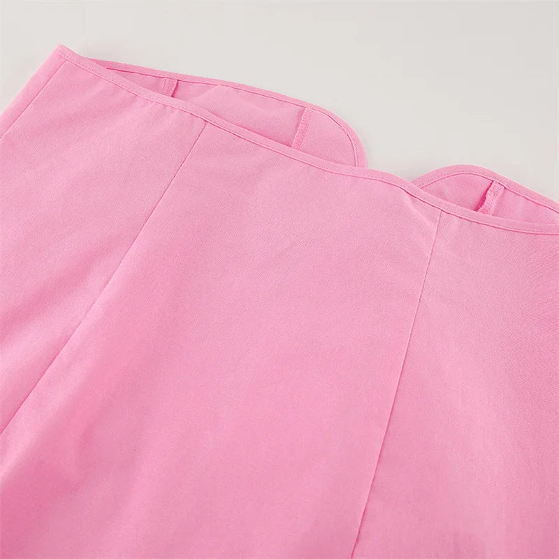 Close-up of pink fabric with a plain background