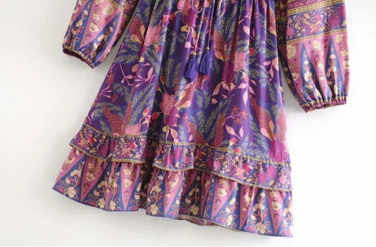 Multicolored patterned dress on a white background