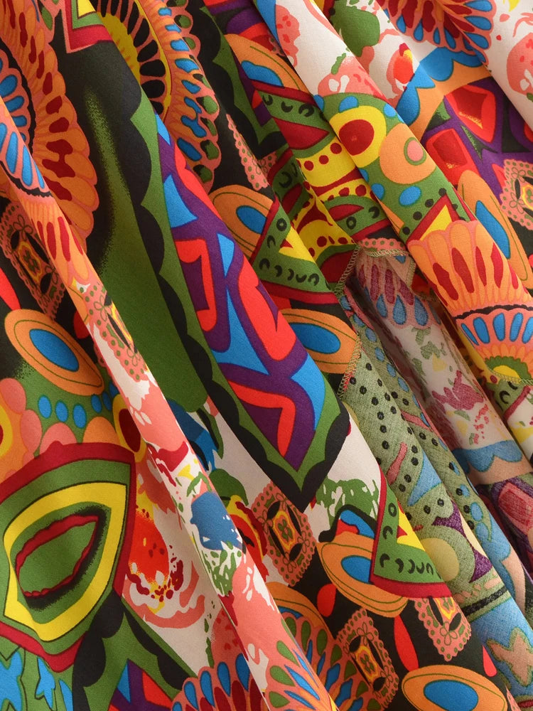 Colorful fabric with abstract patterns in various bright colors.