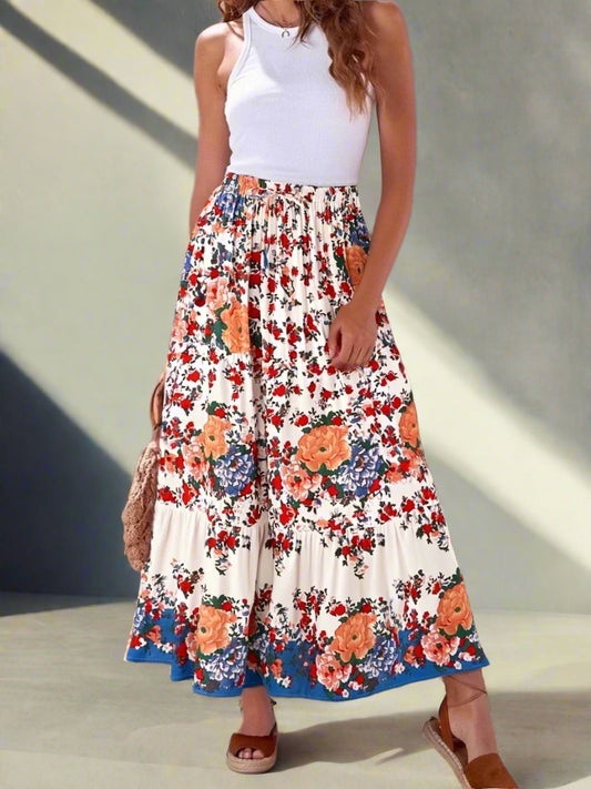 Woman wearing a floral skirt with a white top