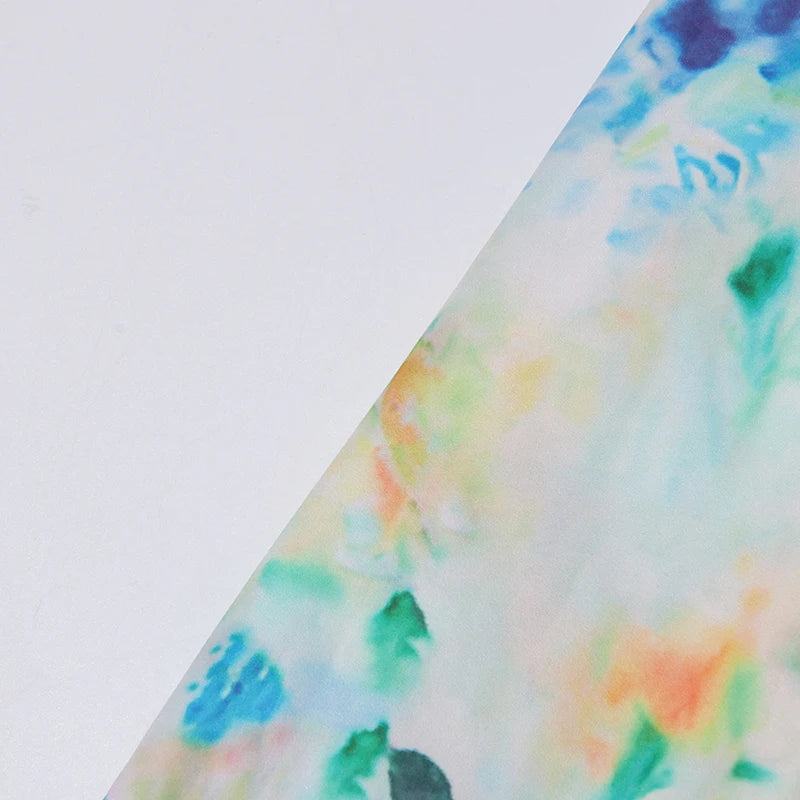 Colorful tie-dye pattern on a white background