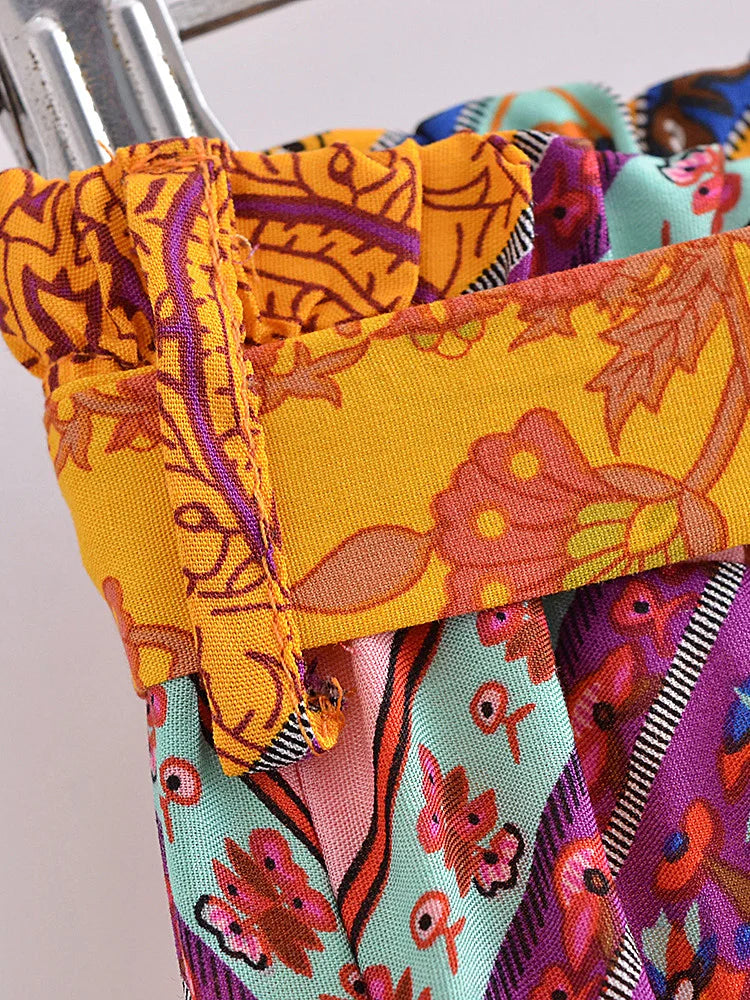 Close-up of colorful fabric with intricate patterns on a white background