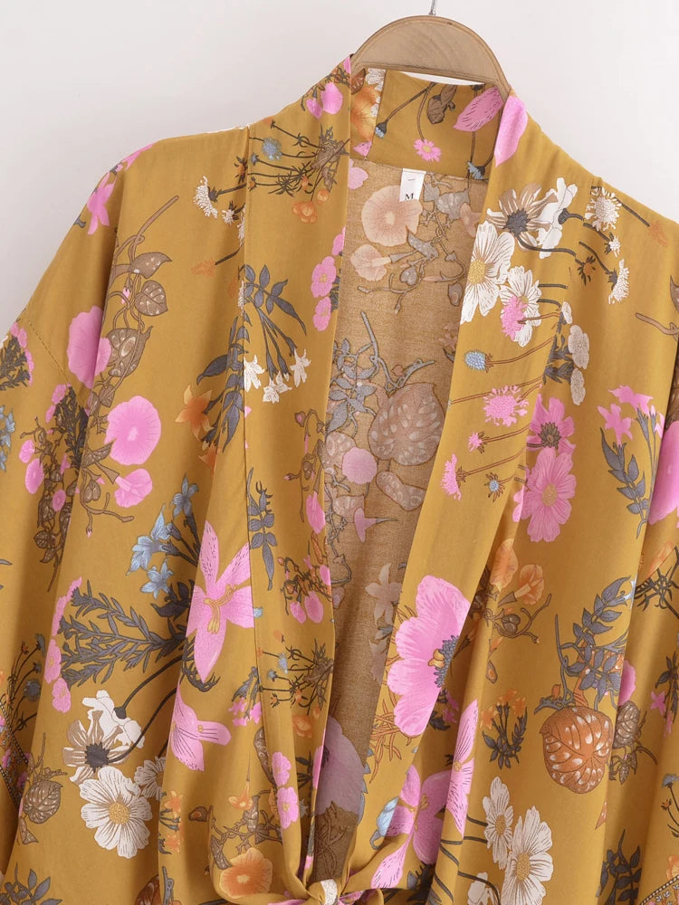 Floral-patterned garment on a hanger against a white background