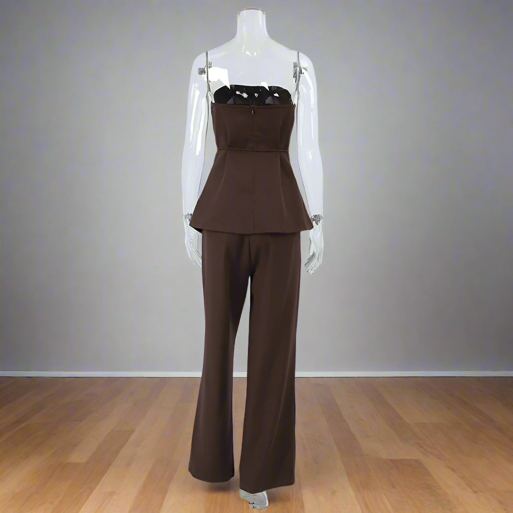 Brown pantsuit on a mannequin against a white background