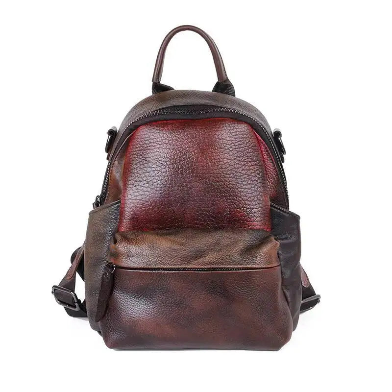 Brown leather backpack with a red section on a white background