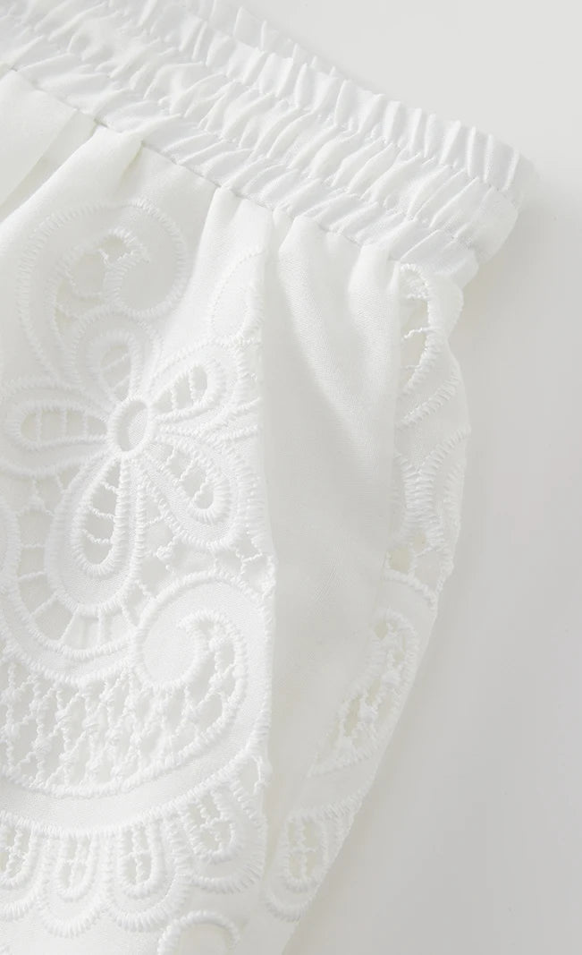White lace fabric on a light gray background