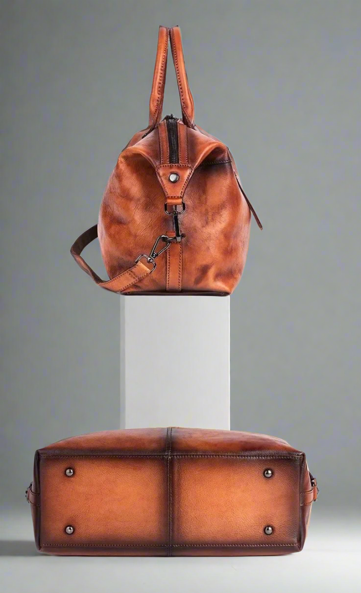 Brown leather backpack on a white background