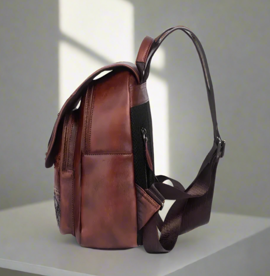 Brown leather backpack on a white background